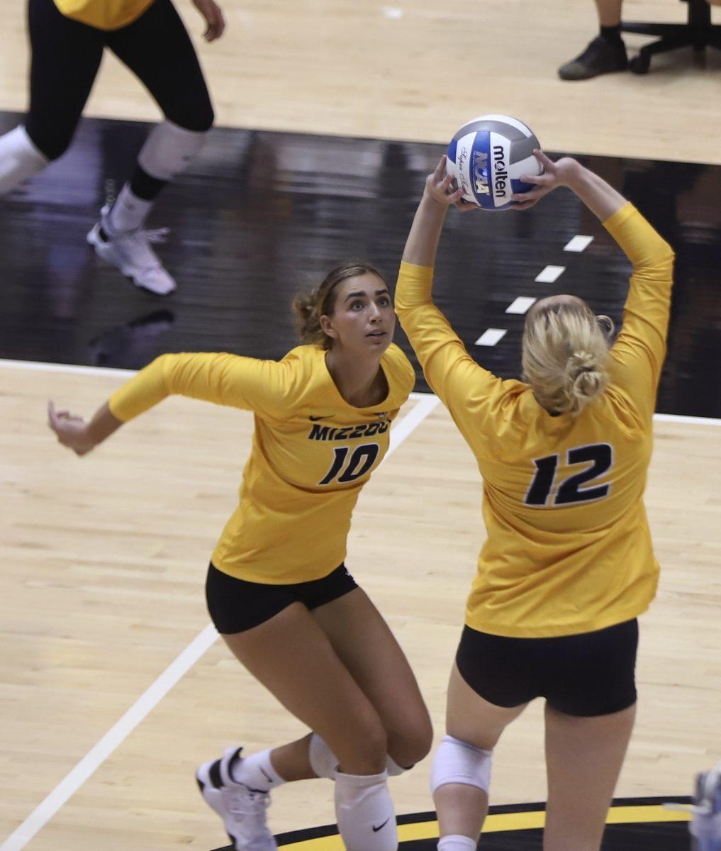 MU volleyball players Anna D’Cruz and Nicole Alford both reach for the ball on Tuesday, Sept. 14, 2021 at Hearnes Center in Columbia.