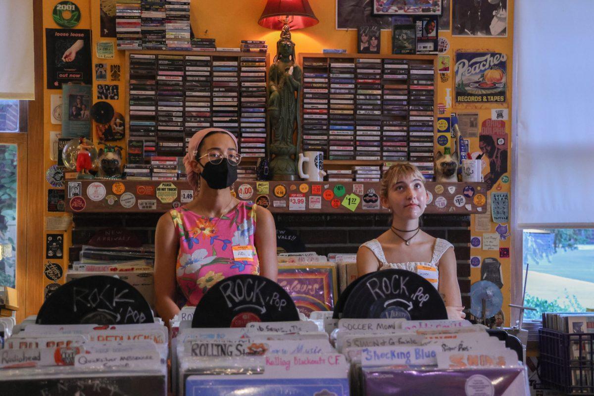 Two people listening to Mitski’s new album at Hitt Records.