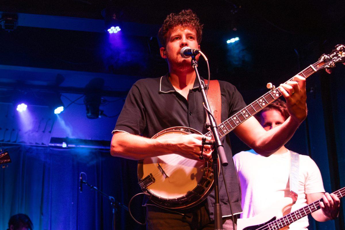 A banjo player performs during a concert.
