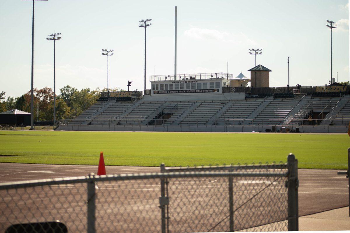 A soccer field and the stands.