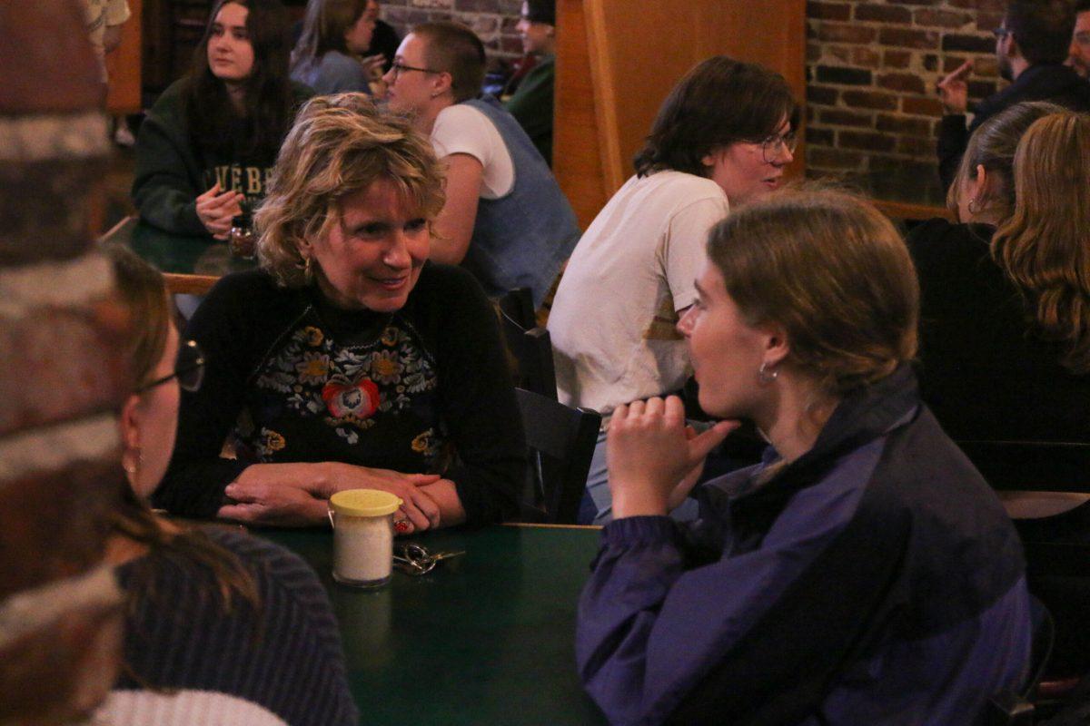 Woman speaking with a girl.