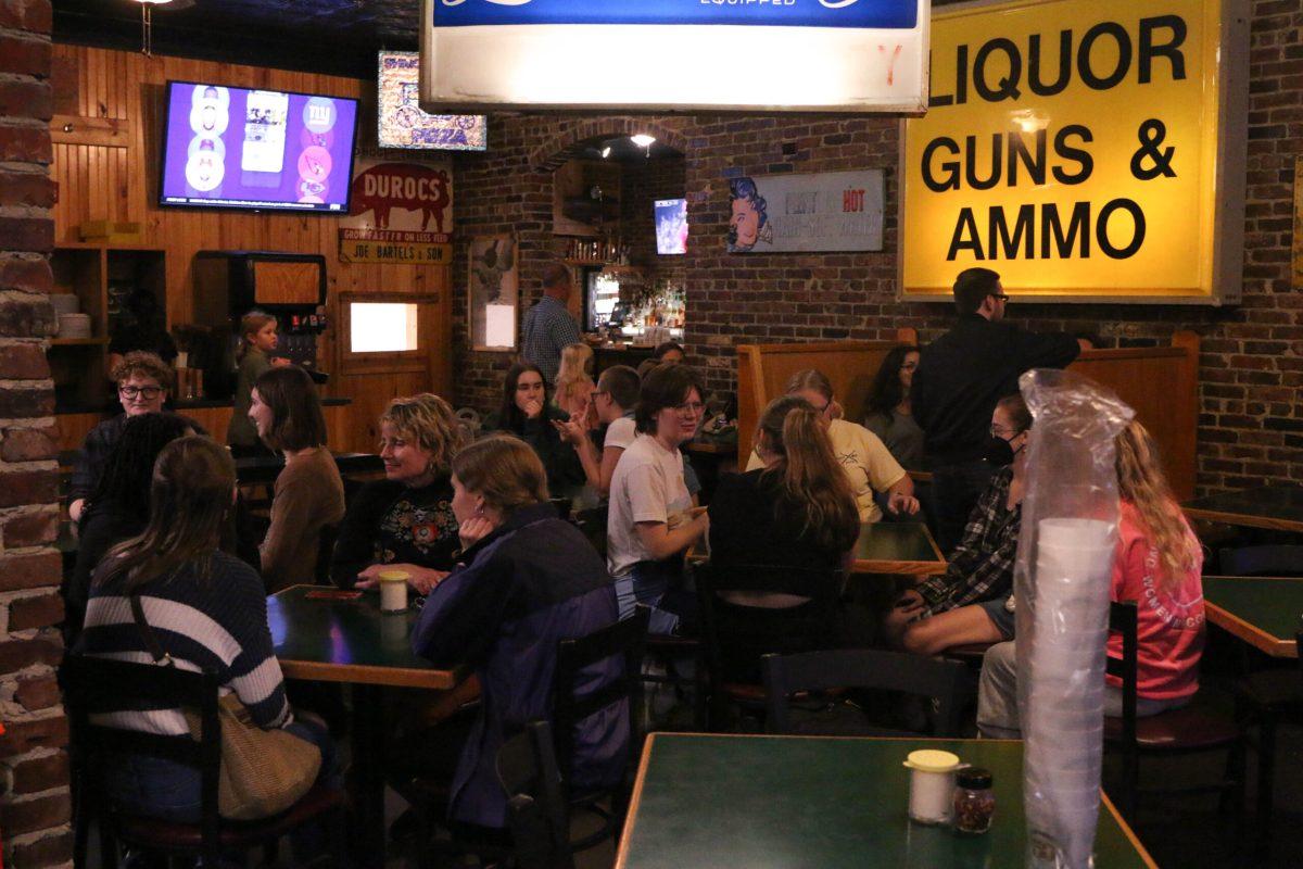 Interior of a restaurant filled with people.