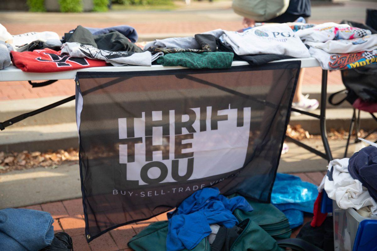 A banner waves at the vintage fair to bring in students.