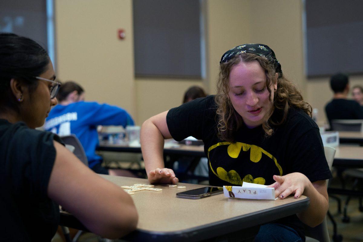 Student Lydia Williams plays “Scrabble” with her friend Arya Kalathil.