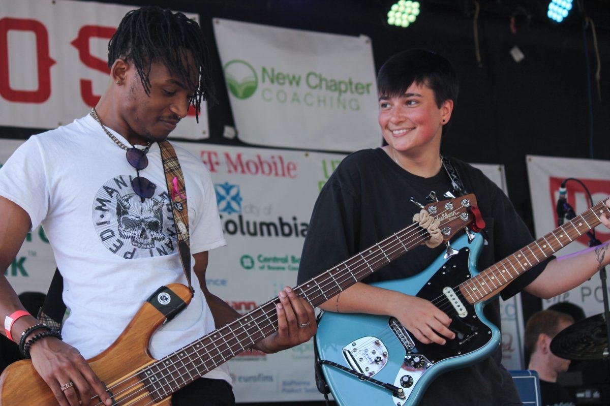 Two band members playing guitar.