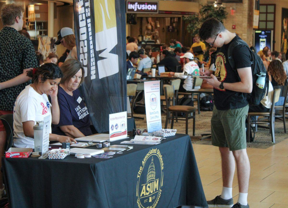 A student registering to vote at the Boone County Clerk’s Office booth inside the Student Center.