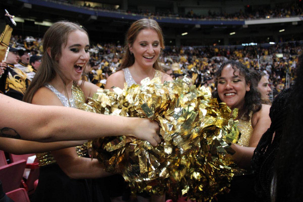 The color guard spends time between pom routines having fun at the Dome at America’s Center in St. Louis.