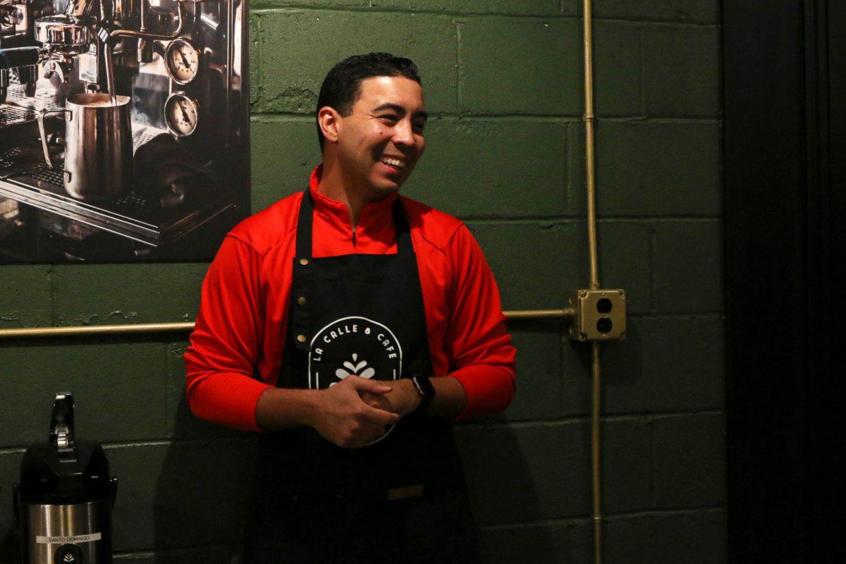 Rafael Bobea smiles to coffee patrons while giving his speech.
