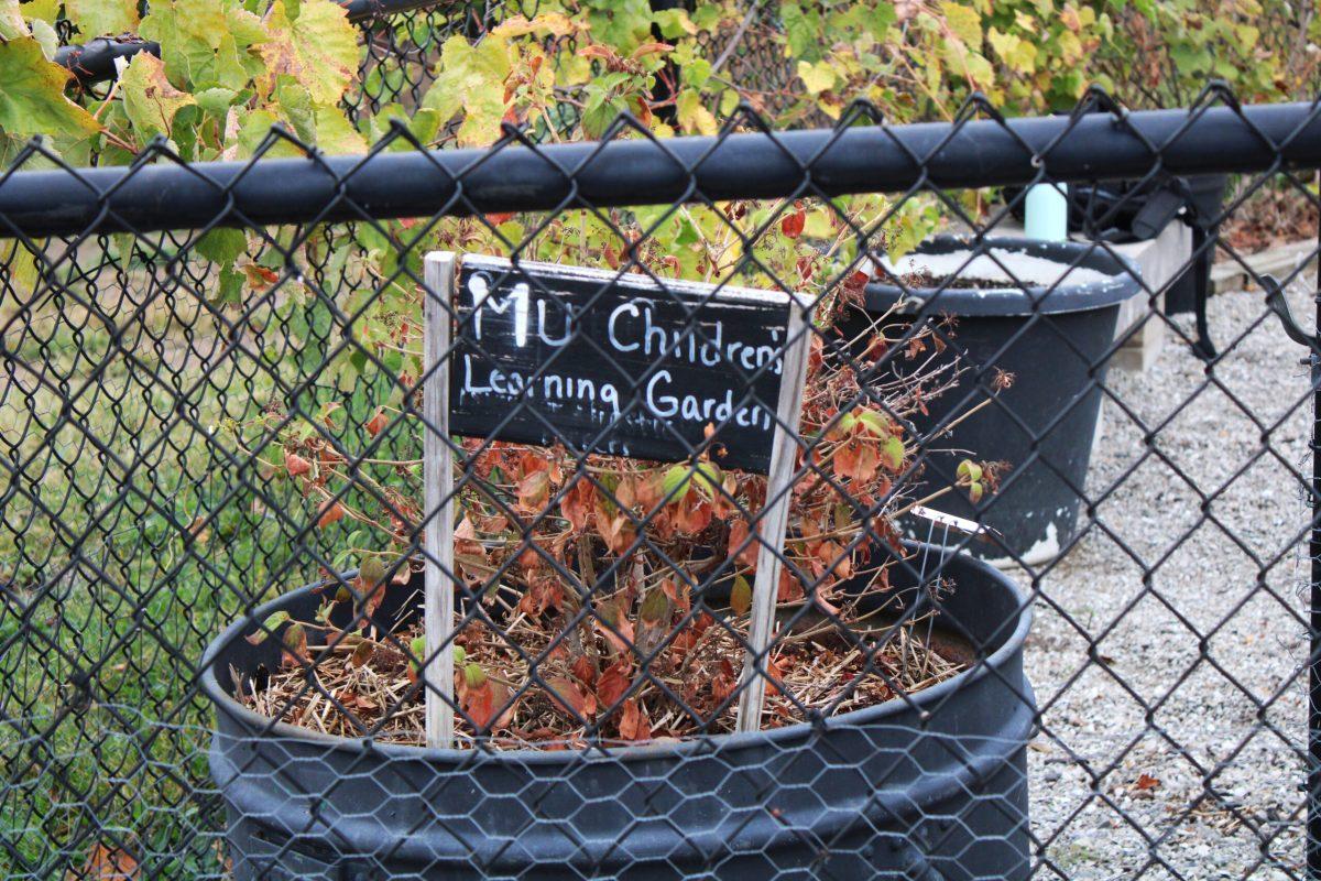 A “MU Children’s Learning Garden” sign is displayed at the front of the garden.
