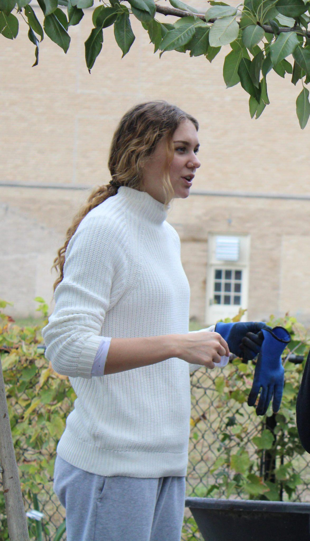 Emma Parry works with other students and gardeners in the MU Children’s Learning Garden.
