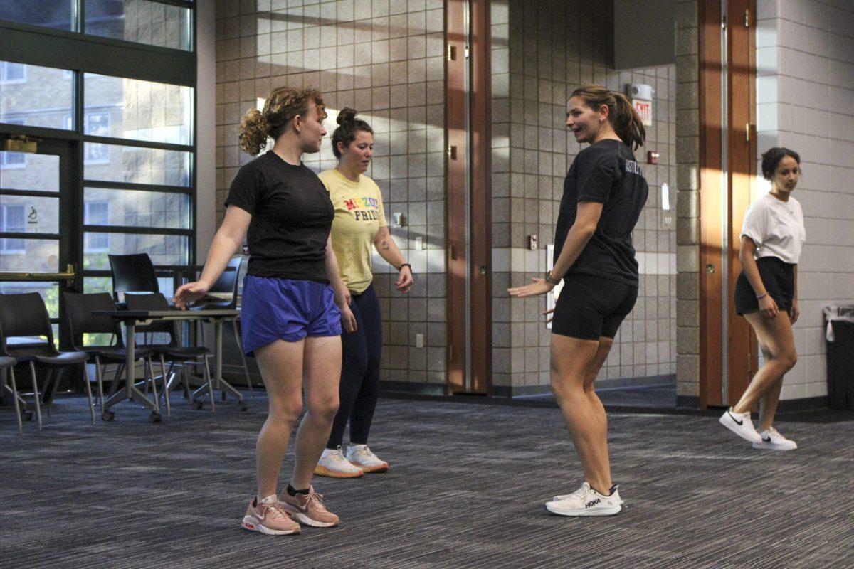 Senior Libby Mooney, Student support specialist Sophia Hood, graduate student and fitness instructor Charlotte Steimle and junior Mya Franklin dance at the Gaines/Oldham Black Culture Center in Columbia, Missouri.