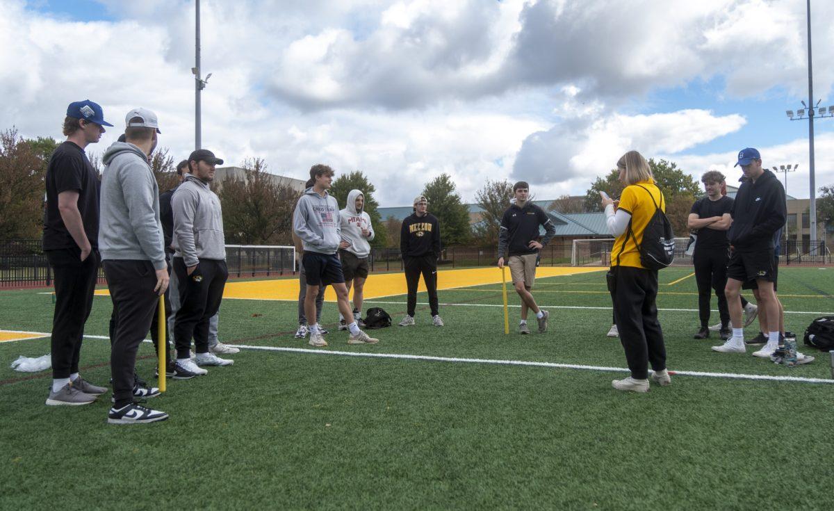 The MU Intramural wiffleball teams discuss the rules before their games. 