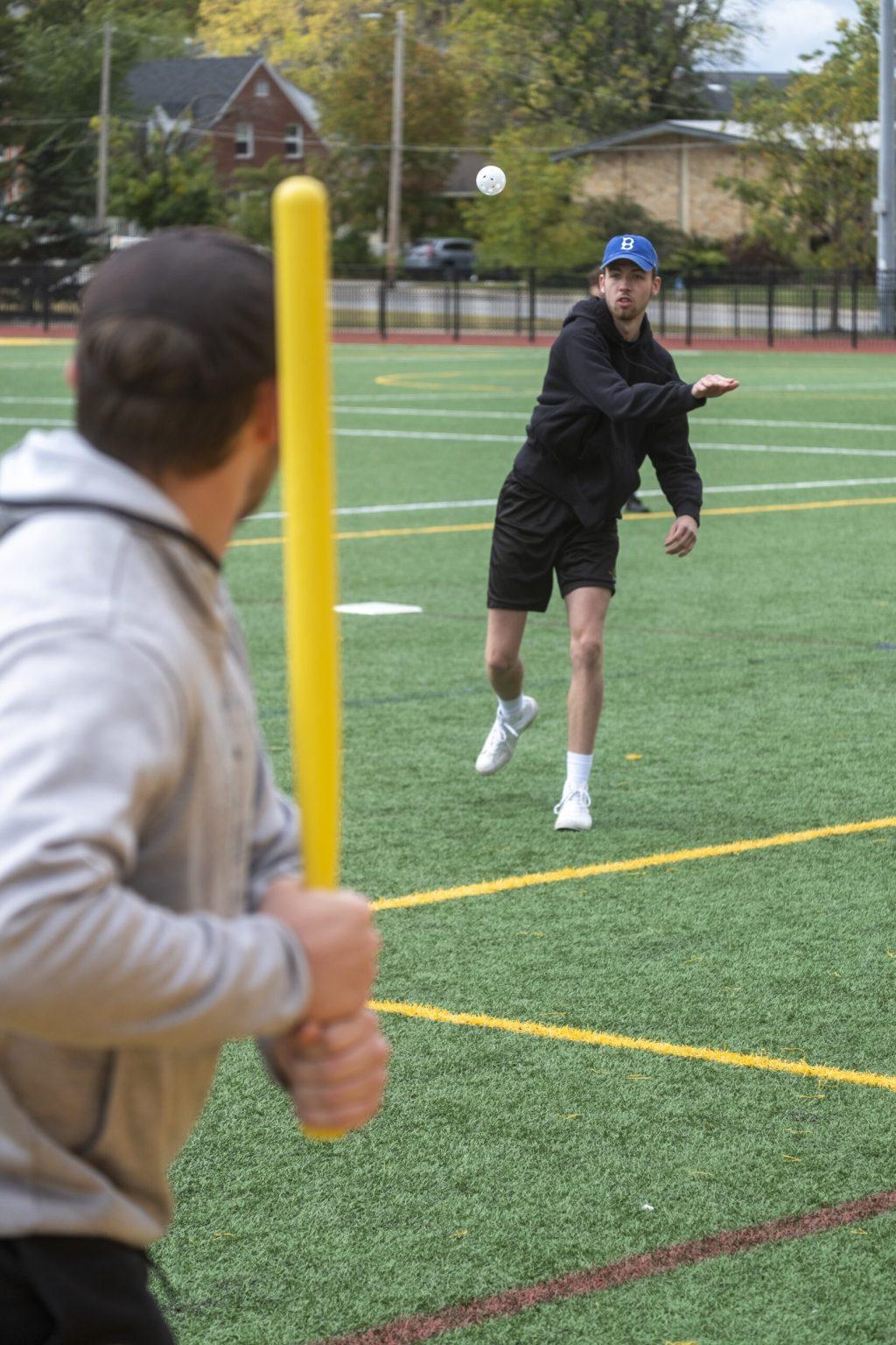 Senior Richard Deutsch of Beta Sigma Psi pitches to sophomore Zane Wilson of Tau Kappa Epsilon during an intramural wiffle ball game. 