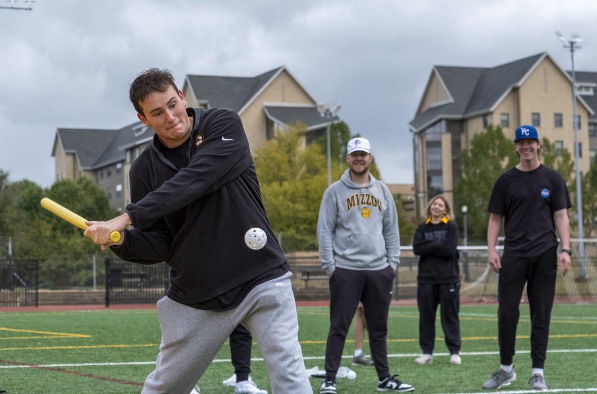 Freshman Trey Johnson of Tau Kappa Epsilon hits a ball during the final round of the wiffleball tournament.