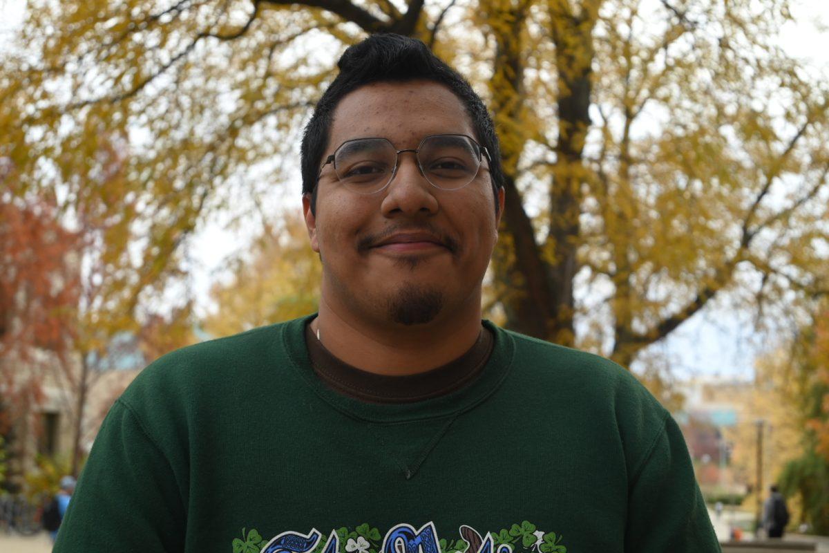 Headshot of man outside during fall.