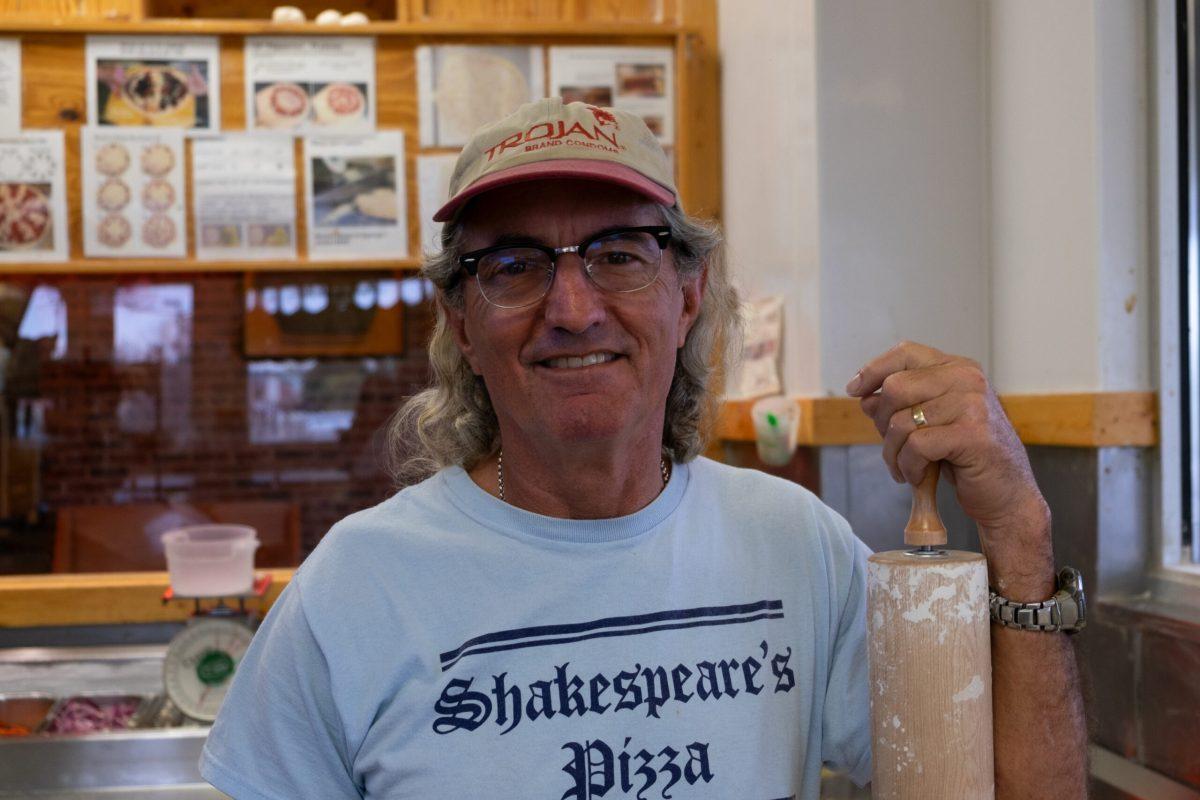 Kurt Mirtsching smiles inside of Shakespeare’s Pizza’s South location.
