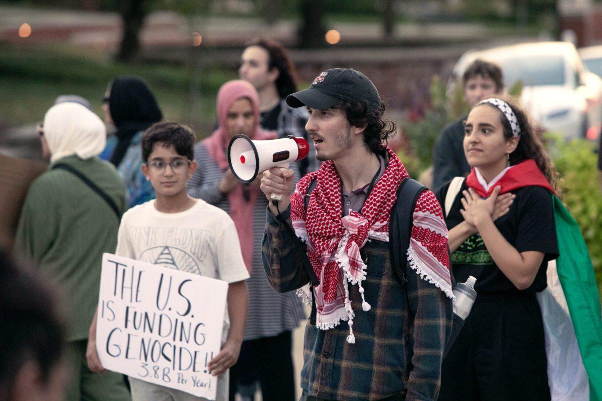 Ethan Waterman speaks on megaphone