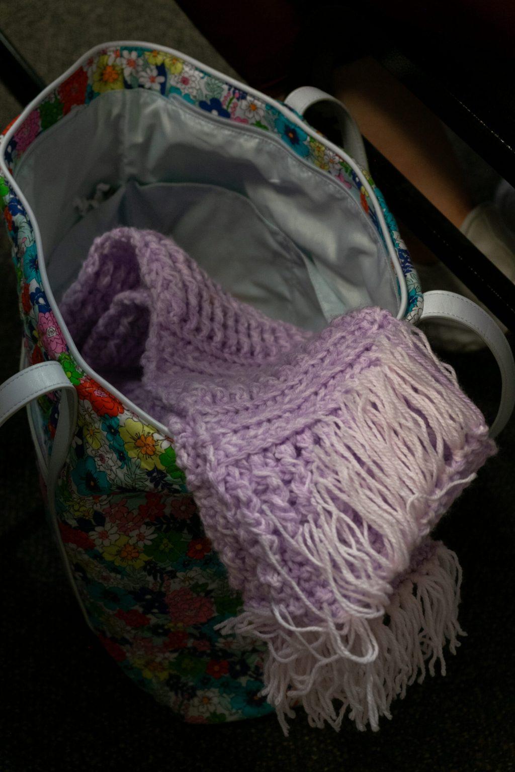 A scarf sits in a bag.