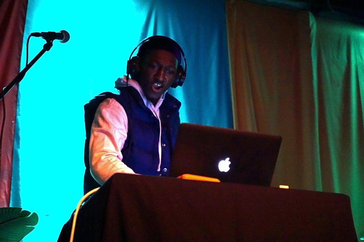 A man plays music on his computer.