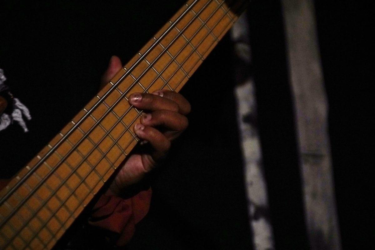 A woman plays the bass.
