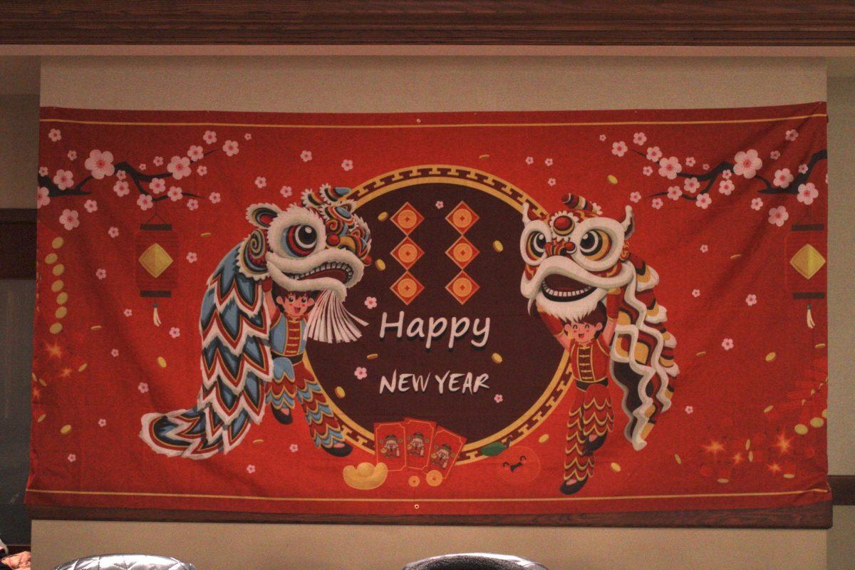 A banner reading “Happy New Year” is presented.