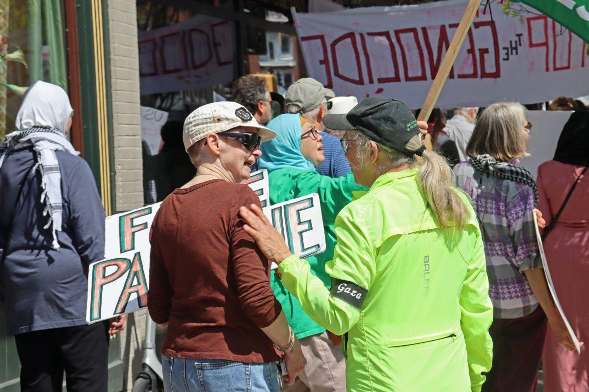 Protestor speaks with a traffic marshal.