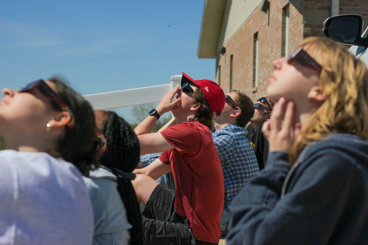 Students watching the eclipse pass.
