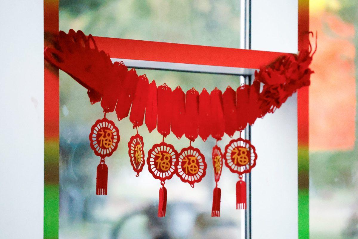 Decorations hanging in a window.