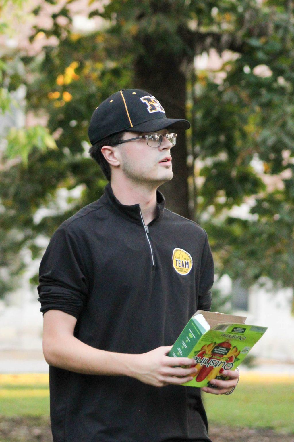 A TEAM member passing out popsicles.