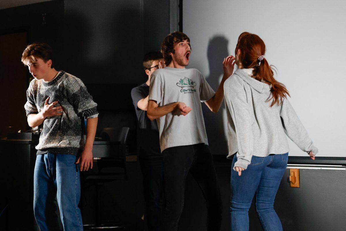 An actor yelling at another actor while performing.