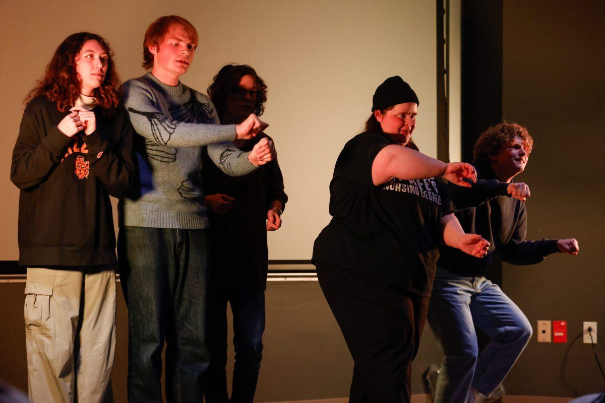 A group of actors performing.