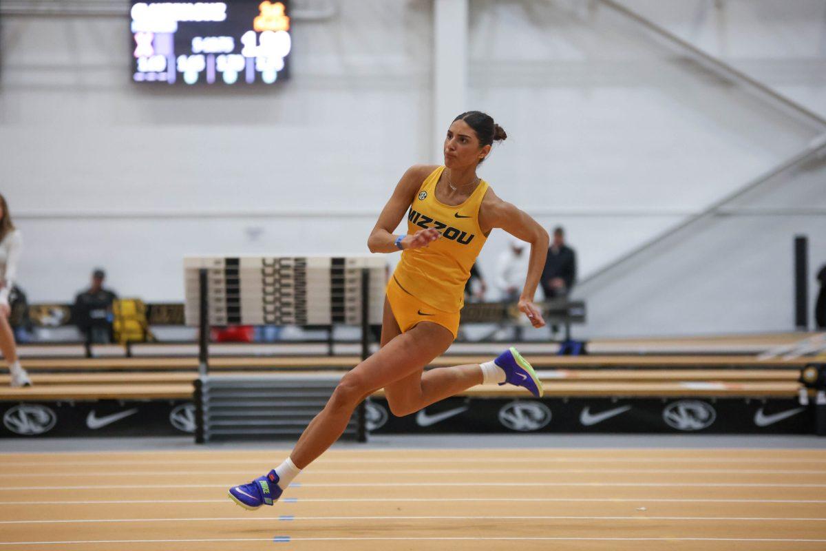 Mizzou high jumper starts her run up.