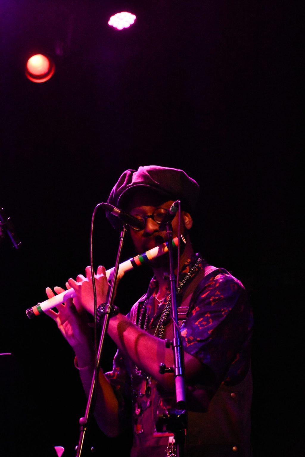 A man plays flute.