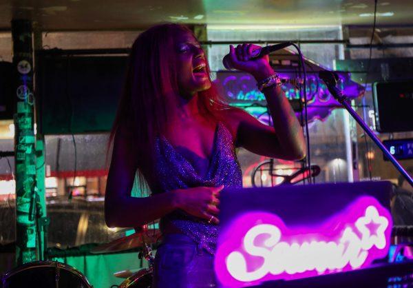 A person sings into the microphone.