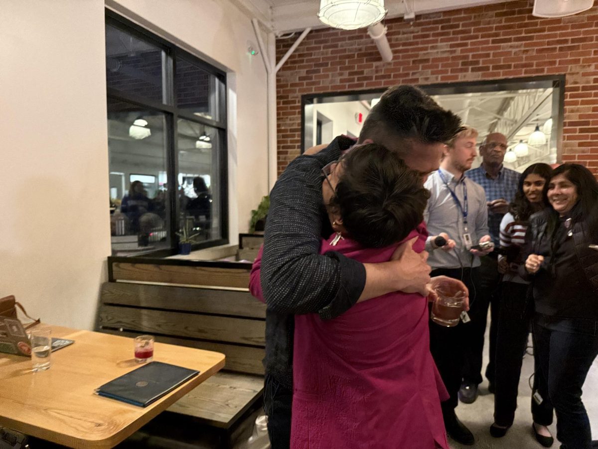 Newly re-elected Mayor Barbara Buffaloe hugs campaign volunteer David Wilson after her victory was announced at her campaign’s election watch party on Tuesday, April 8, 2025, at Ozark Mountain Biscuit & Bar in Columbia, Mo. “Barb is just a fantastic ambassador for Columbia and a mayor we can all be proud of,” Wilson said.