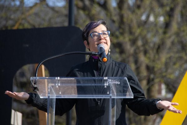 A person speaking at a podium.