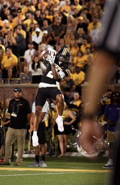 Mariah Zeuschel A Missouri player jumps to catch the ball.