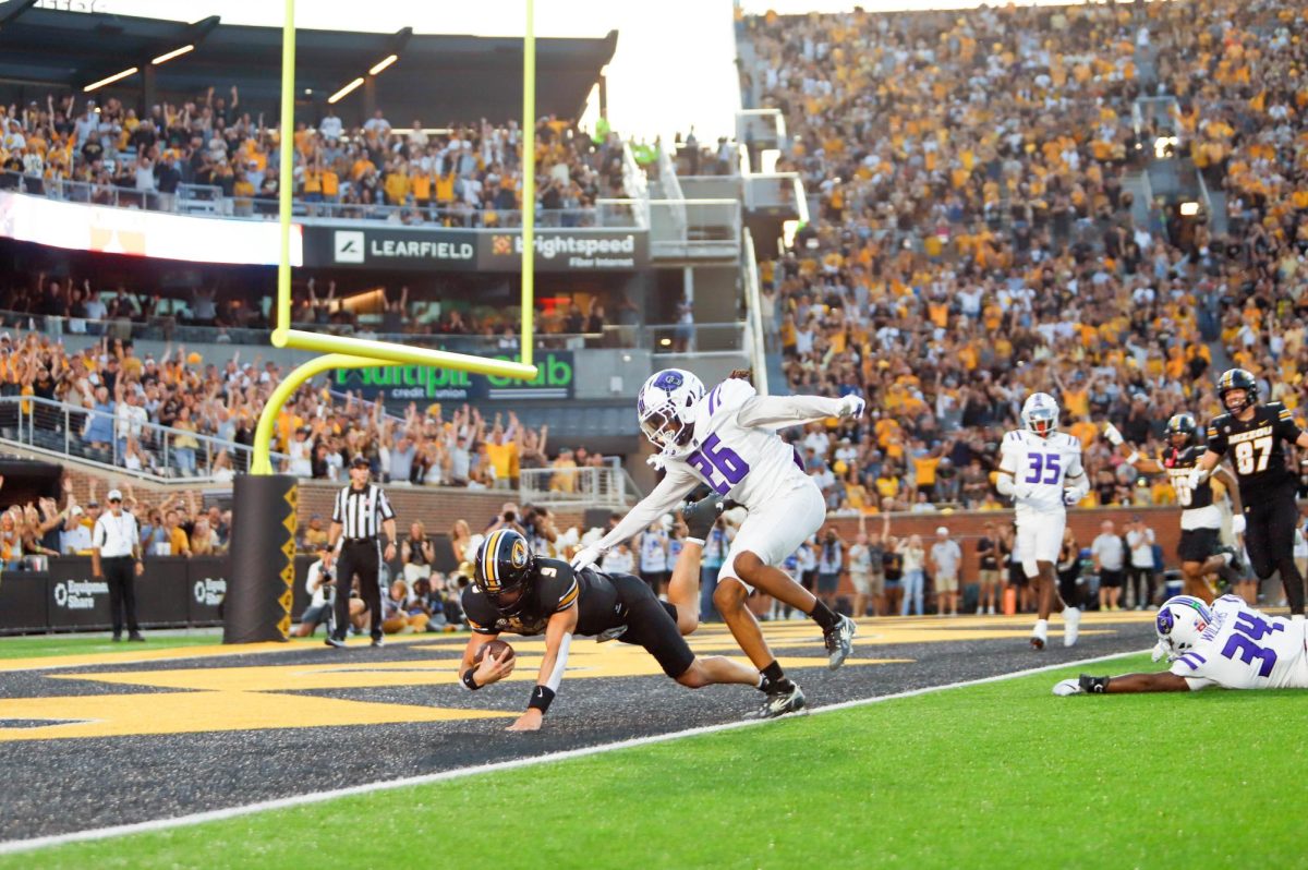 Missouri football player lands in the endzone.