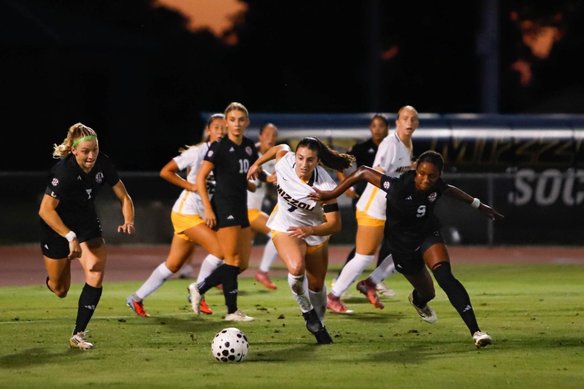 Missouri forward Bella Carrillo lunges for the ball against Mississippi State midfielder Adia Symmonds during the Tigers’ game against the Bulldogs on Friday, Sept. 26 at Walton Stadium in Columbia, Mo. Carrillo registered two shots, one on goal, and played 63 minutes in the game.