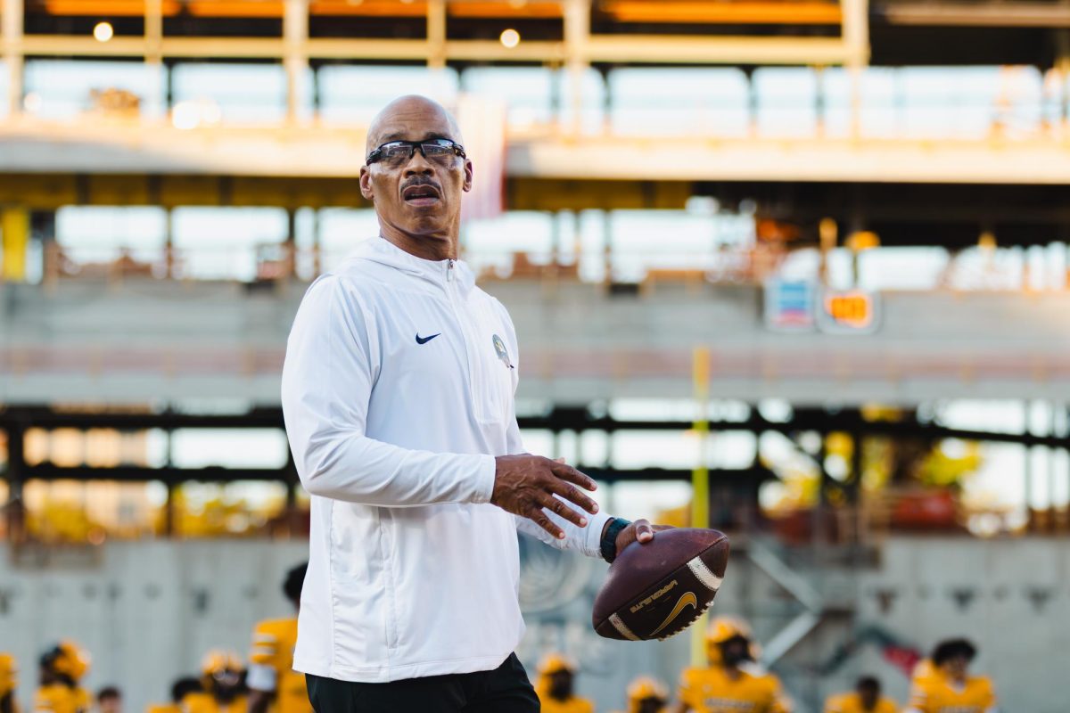 Missouri running backs coach Curtis Luper prepares to throw a football in warmups prior to the game against Massachusetts on Saturday, Sept. 27, at Memorial Stadium in Columbia, Mo. In each of his five seasons at Mizzou, the Tigers have put up at least 20 rushing touchdowns.