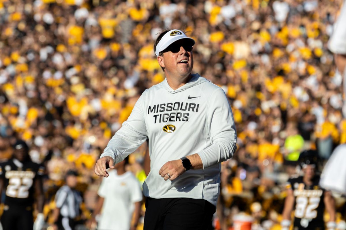 Missouri Head Coach Eliah Drinkwitz stands looking out into the crowd during Missouri’s game against Central Arkansas on Thursday, August 28, 2025 at Faurot Field in Columbia, Mo. With Drinkwitz as the head coach, he has led the Tigers to a 27-7 overall total record. 
