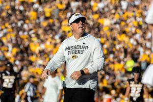 Missouri Head Coach Eliah Drinkwitz stands looking out into the crowd during Missouri’s game against Central Arkansas on Thursday, August 28, 2025 at Faurot Field in Columbia, Mo. With Drinkwitz as the head coach, he has led the Tigers to a 27-7 overall total record. 