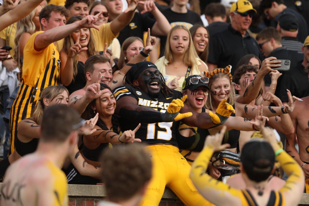 Missouri defensive end Darris Smith poses with the crowd after Missouri’s football game against Kansas on Saturday, Sept. 6, 2025, at Faurot Field in Columbia, Mo. The Tigers beat the Jayhawks 42-31. 
