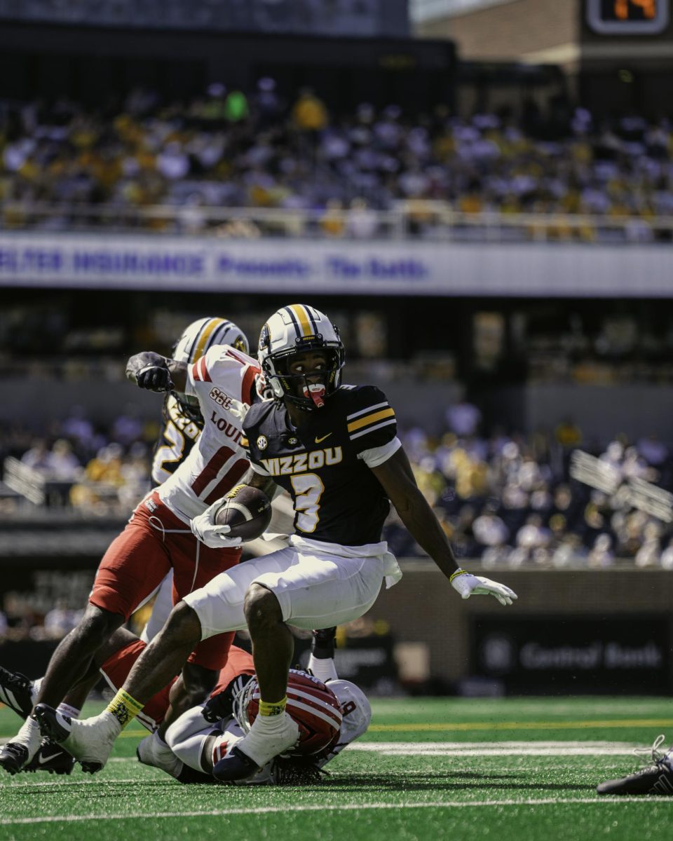 Missouri wide receiver Kevin Coleman Jr. avoids one tackle after receiving the ball from Beau Pribula on Saturday, Sept. 13, 2025 at Faurot Field in Columbia, Mo. Coleman Jr led the team in receiving yards finishing with 84 on 8 receptions against Louisiana Lafayette.