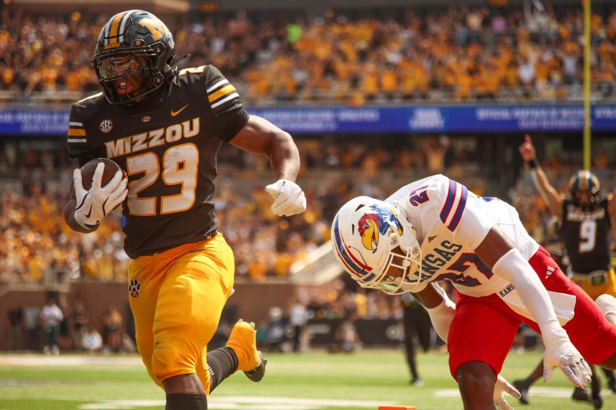 Missouri Running Back Ahmad Hardy breaks a tackle as he scores a touchdown against the Kansas Jayhawks on Saturday, Sept. 6, 2025 at Faurot Field in Columbia, Mo. Hardy finished the afternoon with 112 rushing yards on 25 carries.