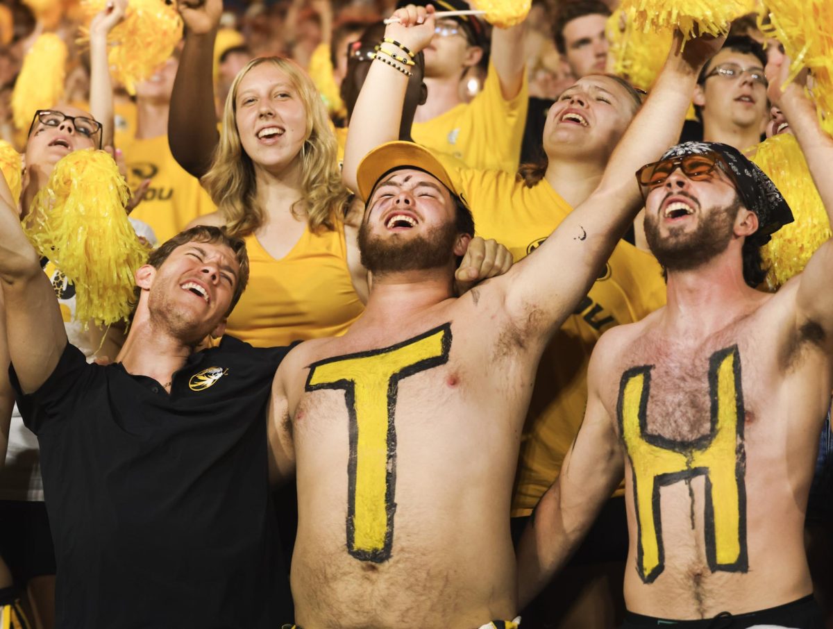Three Missouri students sing along to “Mr. Brightside” by the Killers on Thursday, August 28, 2025 at Faurot Field in Columbia, Mo. The song dates back to being played on campus and at sporting events as early as 2007.
