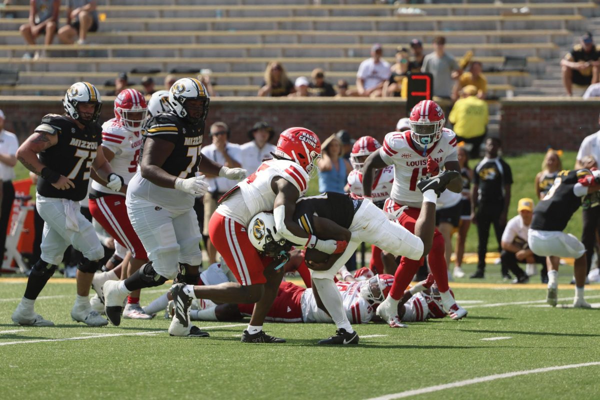 Missouri running back Brendon Haygood is tackled by Louisiana-Lafayette Linebacker Caleb Kibodi on Saturday, Sept. 13, 2025 at Faurot Field in Columbia, Mo. This is Haygood’s first year with Missouri after signing as a three-star recruit from Texas.