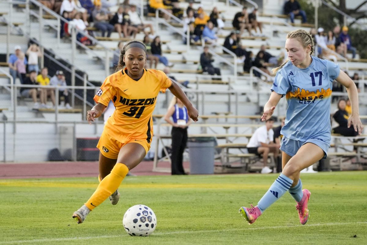 Missouri forward Mia Devrouax presses upfield against defender Olyvia Pugh in the first half of a match against Kansas City on Sunday, Sept. 7, 2025, at Walton Stadium in Columbia, Mo. The Tigers came away with a 1-0 victory over the Roos. 
