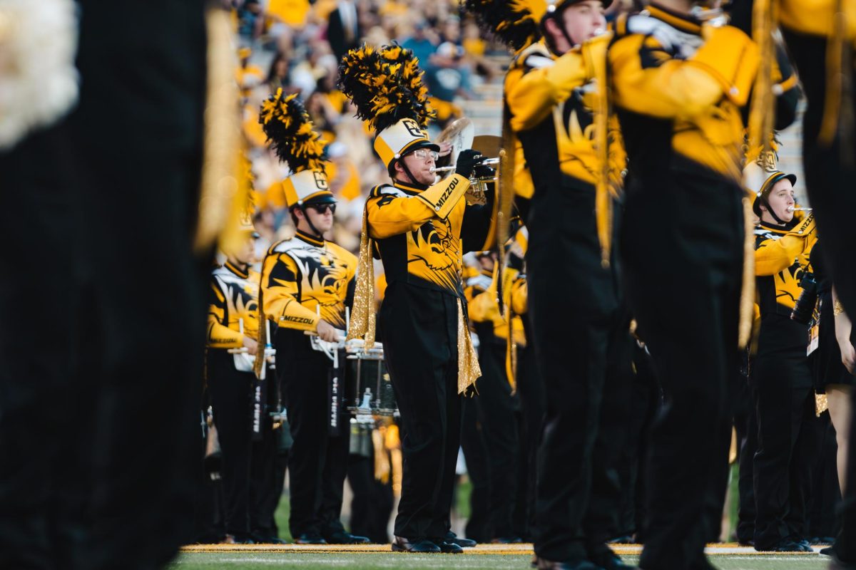 A trumpet player plays his trumpet