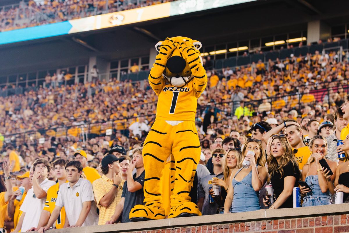 Truman the Tiger covers his eyes